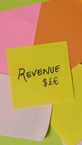 Vertical-Video-Business-Concept-Of-Revolving-Sticky-Notes-With-Revenue-Written-On-Top-Note-1